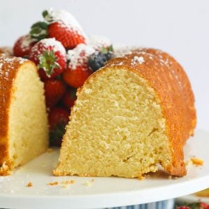 Sliced sour cream pound cake filled with fresh berries