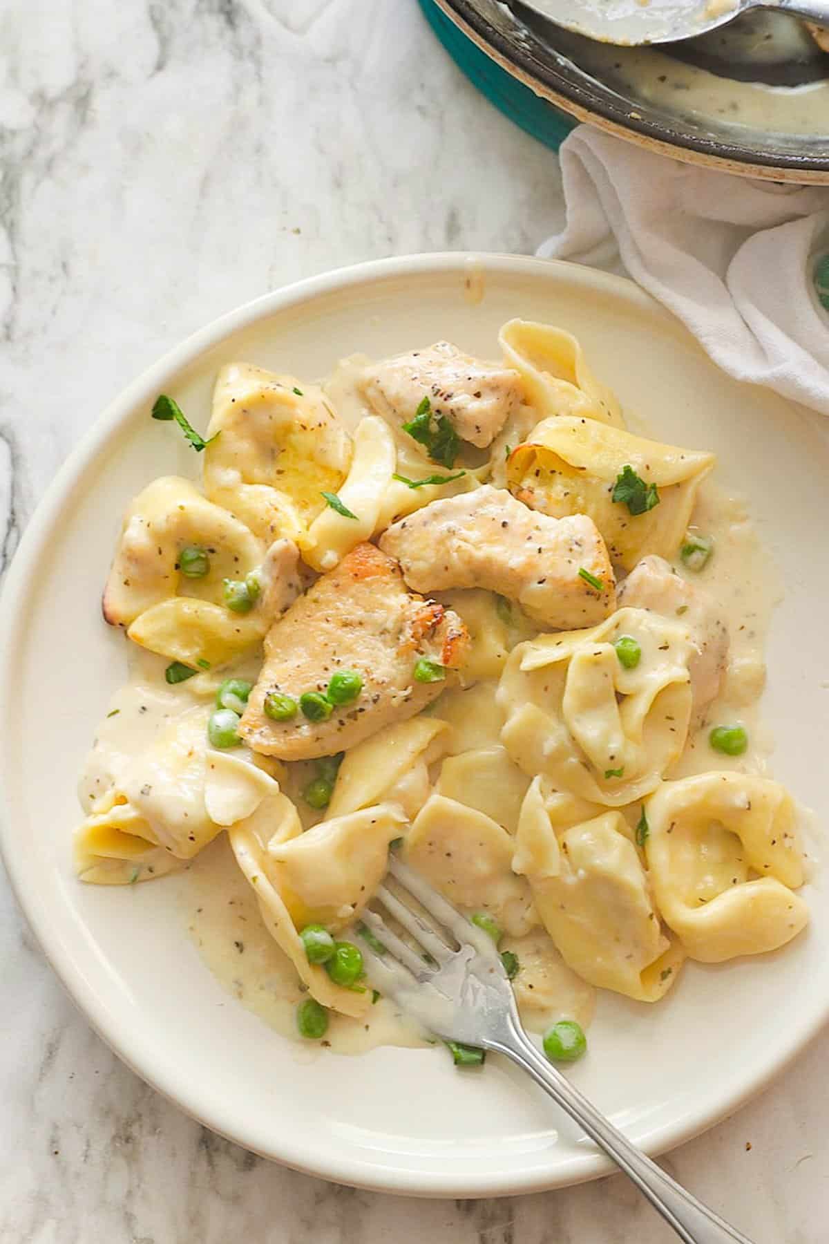 Enjoying a plateful of ridiculously delicious Chicken Tortellini Alfredo