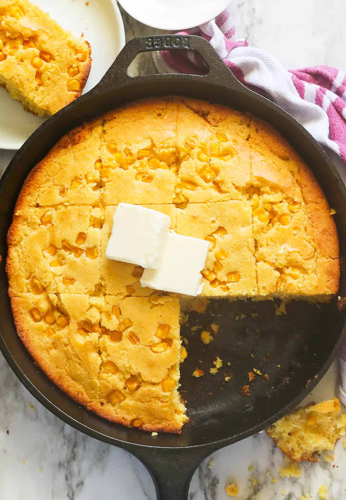 Delectable cornbread with corn with butter melting on top