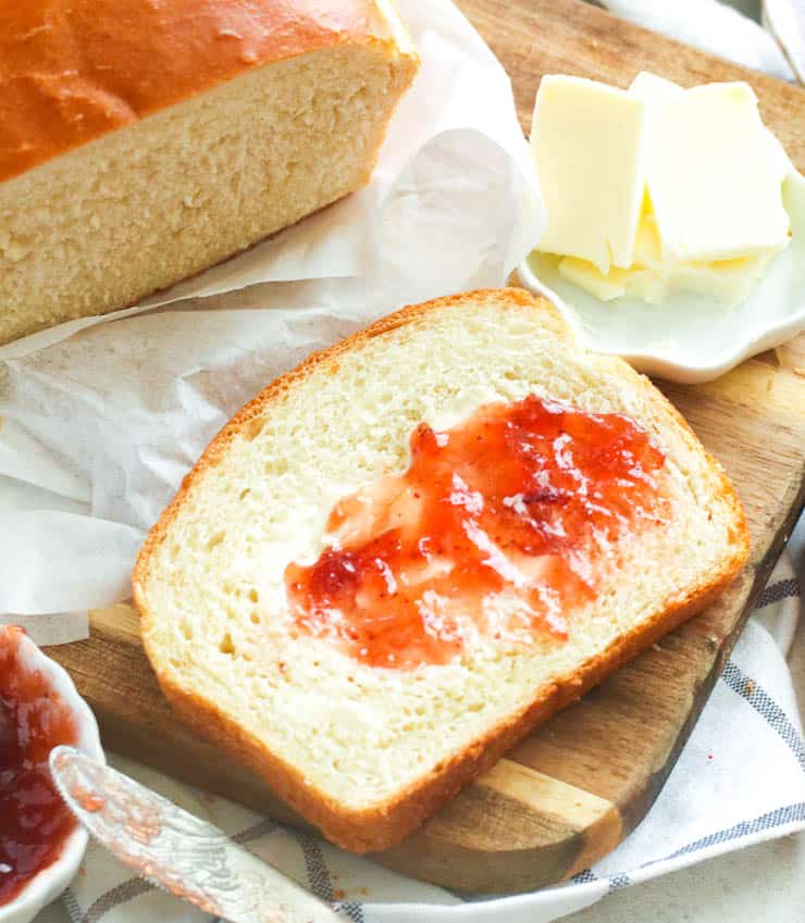 Closeup shot of sliced bread slathered with jam