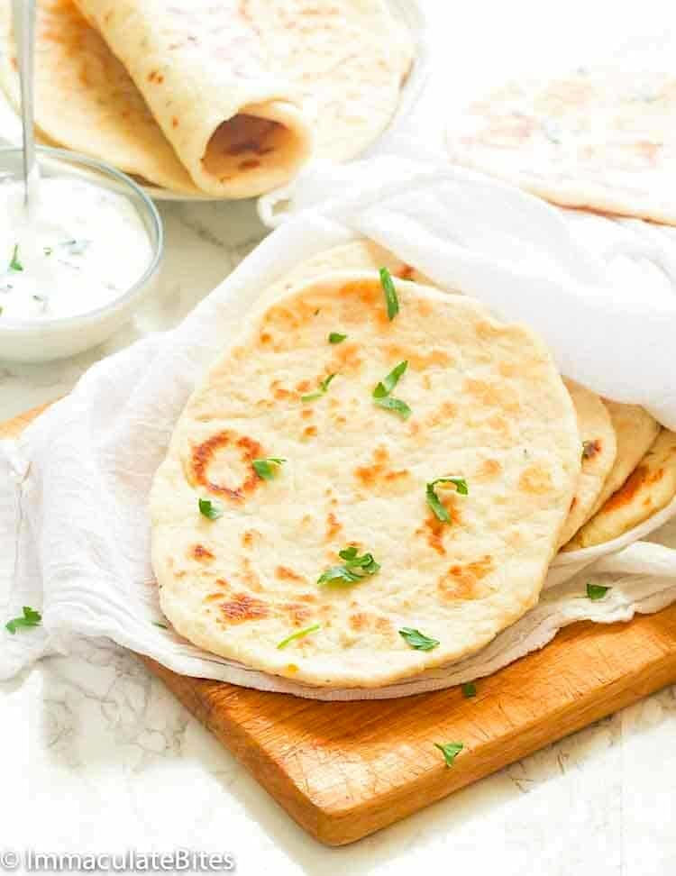 Steaming hot flatbread ready to enjoy with tzatziki