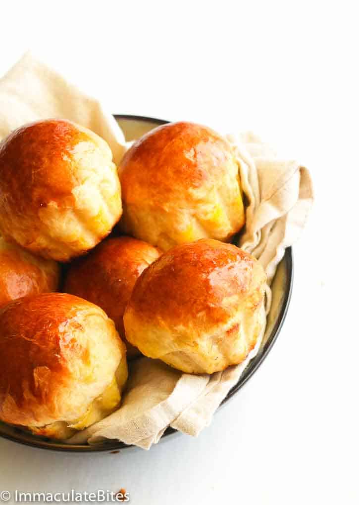 A basket full of decadent brioche buns ideal for a side dish or dessert