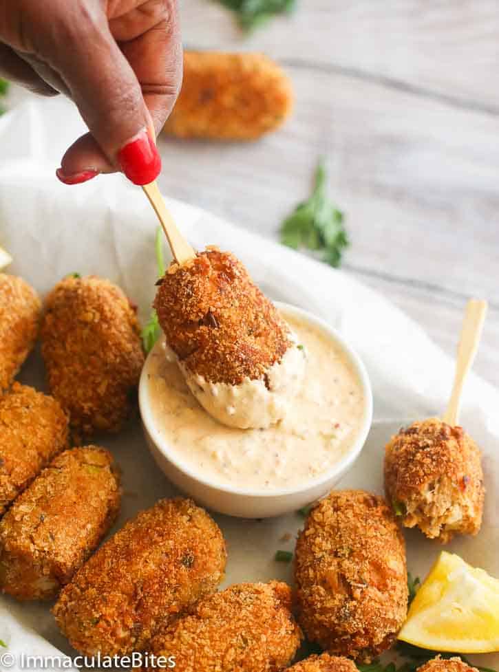 Delicious comfort food in the shape of salmon croquettes dipped in remoulade