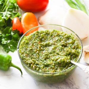 Sofrito with fresh ingredients in the background