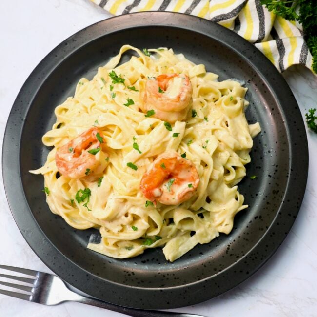 An insanely good plate of shrimp Alfredo pasta