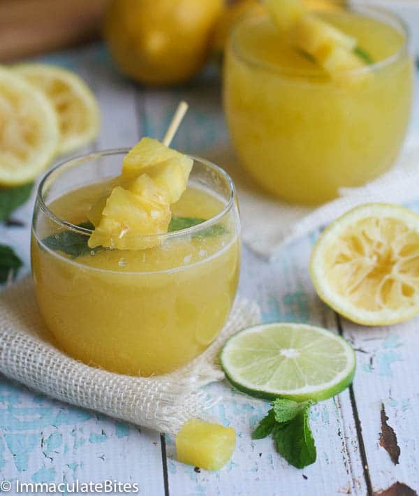 Pineapple Lemonade becomes a refreshing cocktail with sparkling wine and decorated with pineapple chunks on a skewer