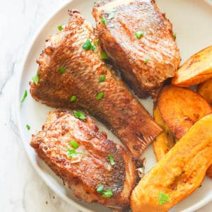 Freshly fried red snapper with plantains