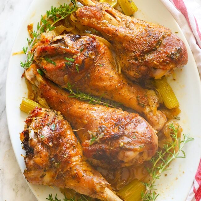 Tender, moist, and super easy Roast Turkey Legs on a white platter