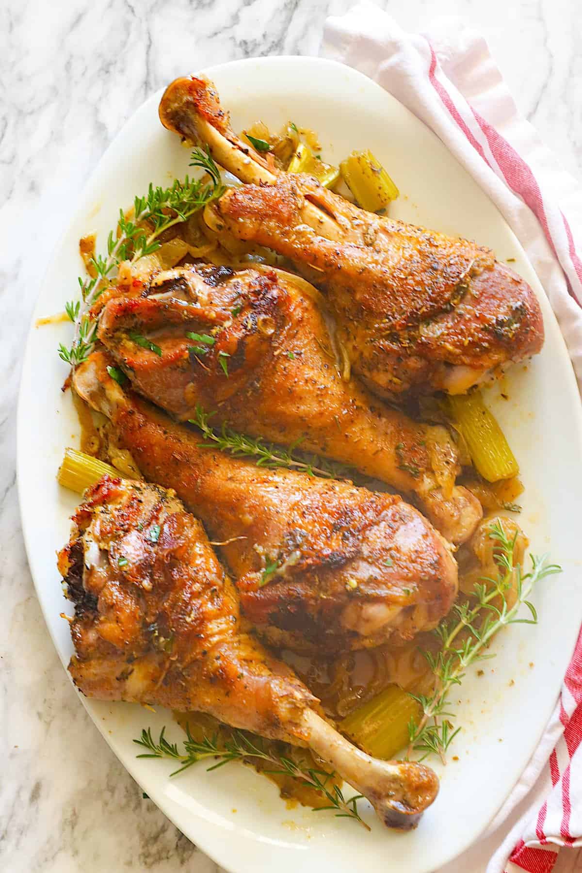 Tender, moist, and super easy Roast Turkey Legs on a white platter