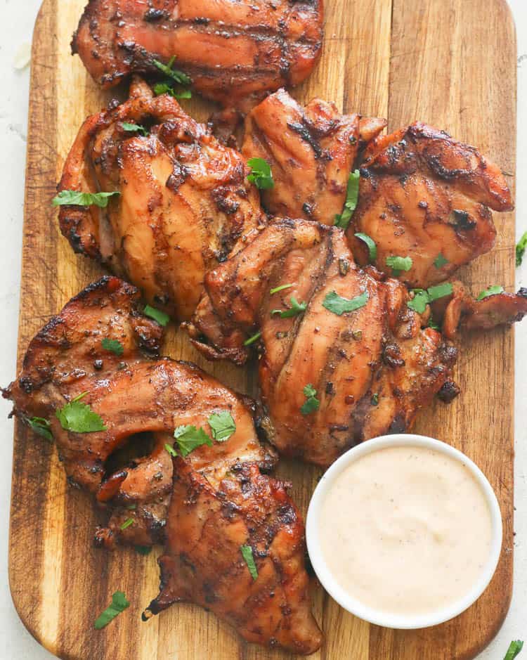 Grilled Jerk Chicken Served on a Chopping Board