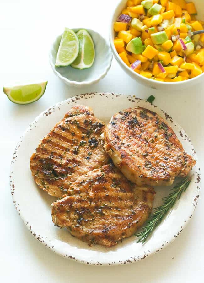 Rosemary Pork Chops with mango salsa and a squeeze of lime for a deliciously easy weeknight dinner