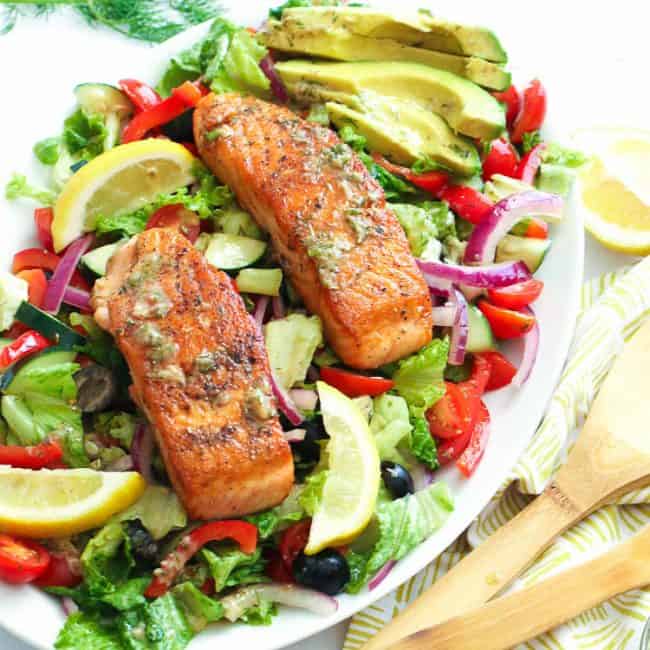 Salmon in a bed of colorful veggies