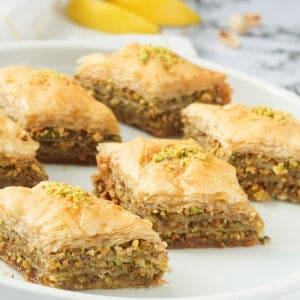 Baklava squares on a white plate