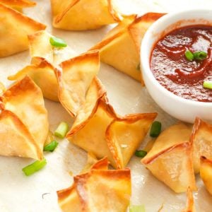 Crispy delicious Crab Rangoon with hot sauce