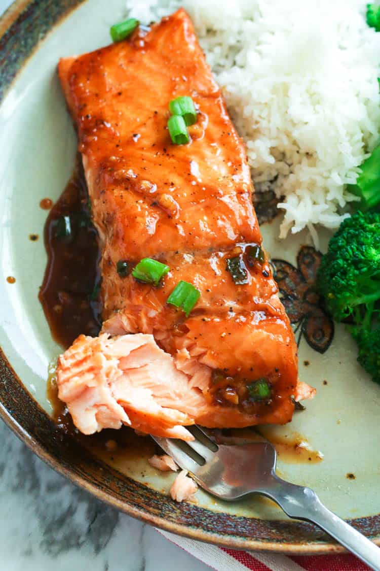 Enjoying a delectable bite of Teriyaki Salmon