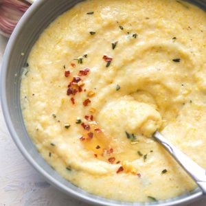 Creamy Polenta with a spoon in a grey bowl