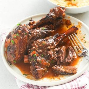 Braised Lamb Shank in a pan