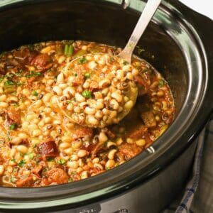 Serving up steaming slow cooker black eyed peas