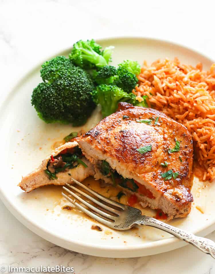 Slicing into a tender, juicy, Stuffed Pork Chops to reveal its inner beauty