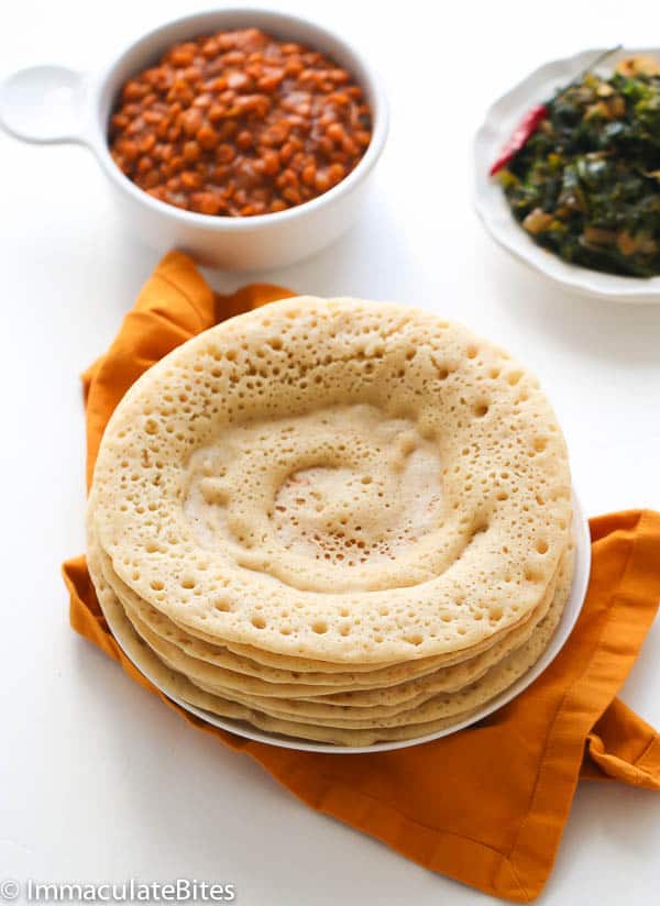 A Stack of Injera Served with Ethiopian Lentils and Greens