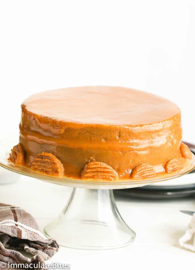 A glossy caramel cake ready to serve