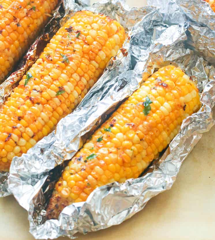 Unwrapping roasted Corn on the Cob 