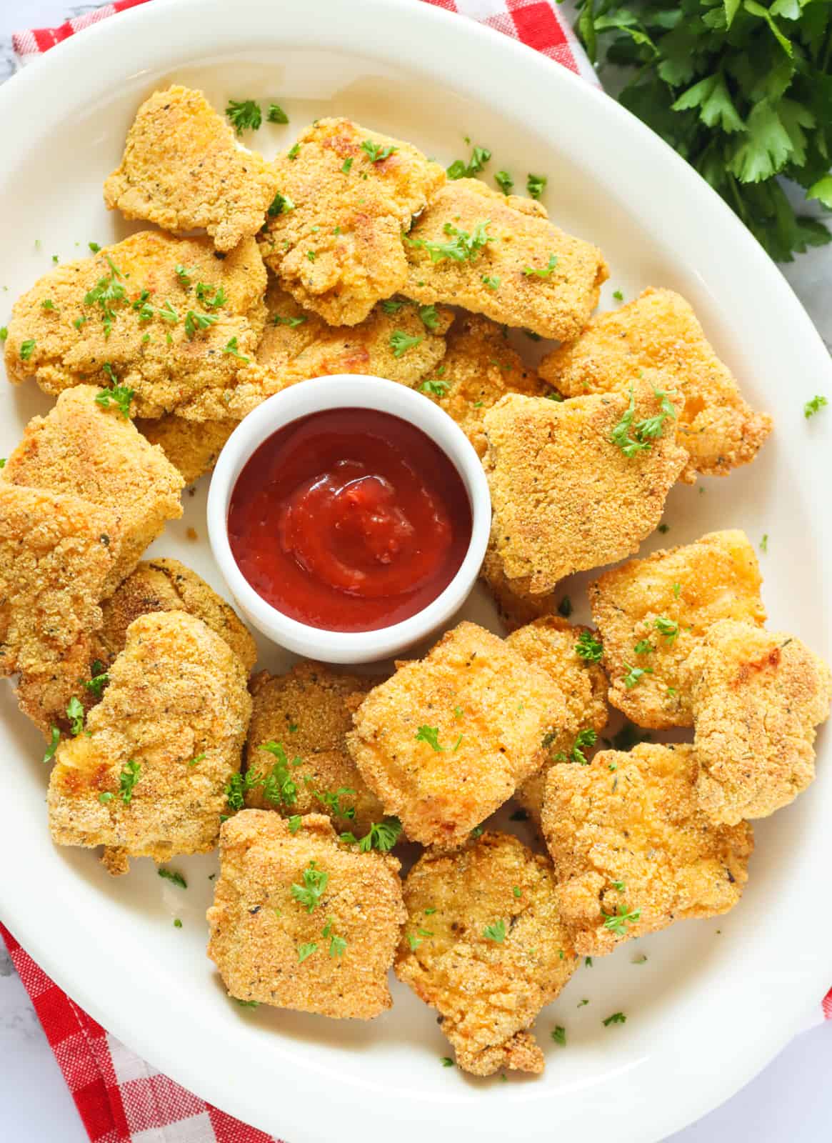 Enjoying a plateful of super delicious fried catfish nuggets with ketchup