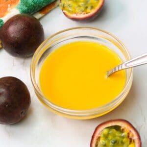 Passion fruit puree in a bow with a spoon